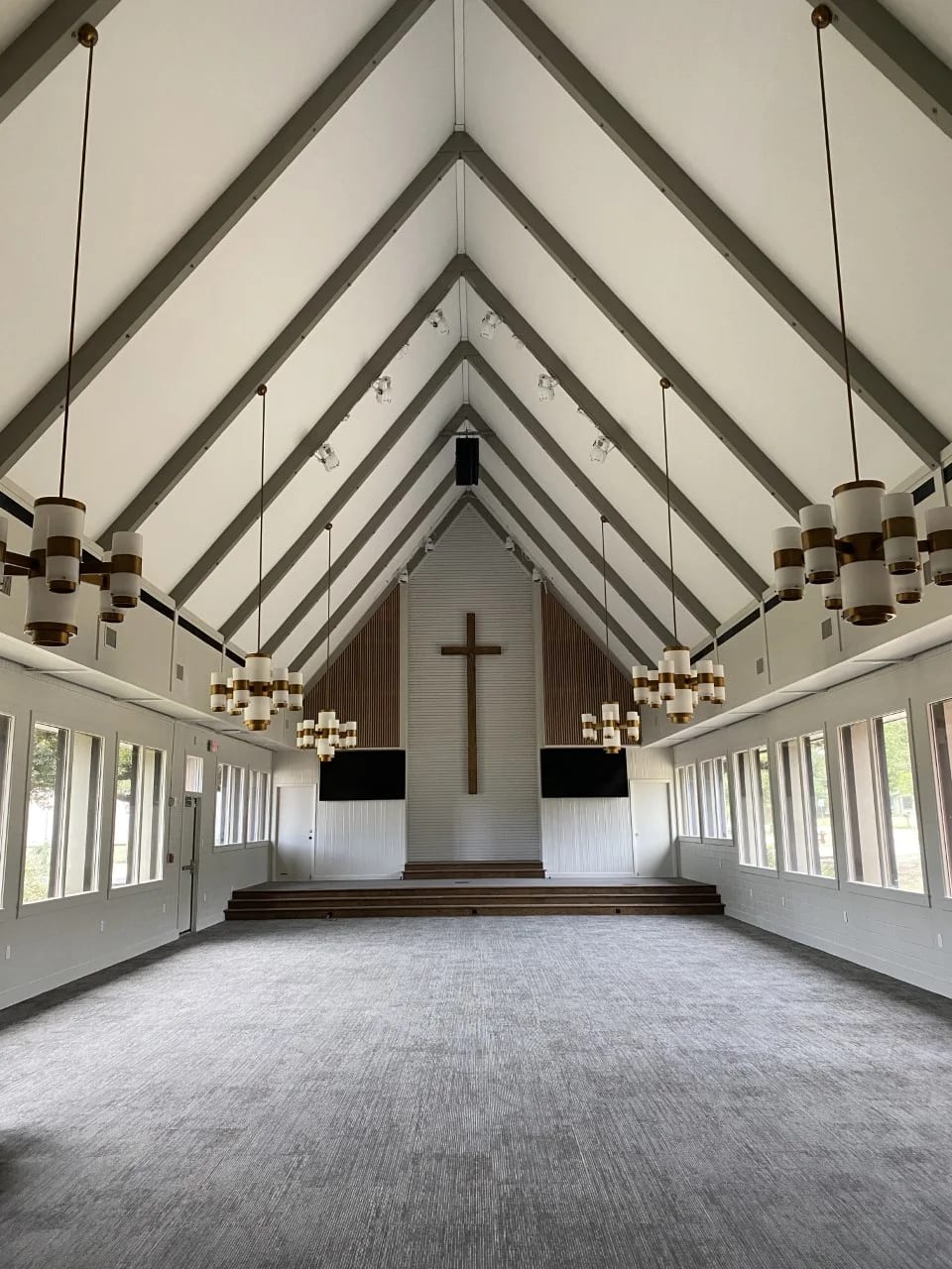 Grace Midtown sanctuary with vaulted ceilings, custom lighting, and a cross