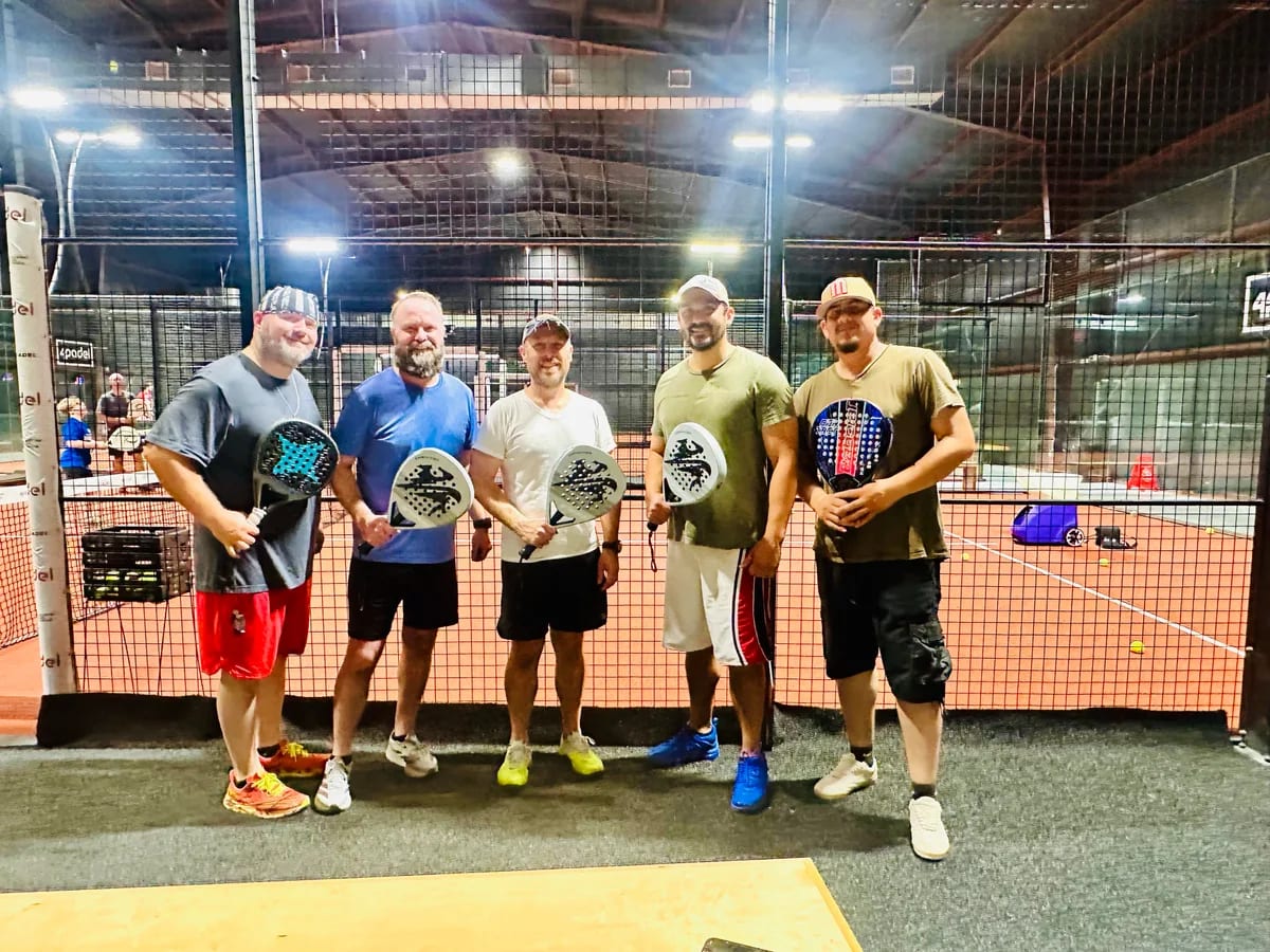 Create team members together on a padel court
