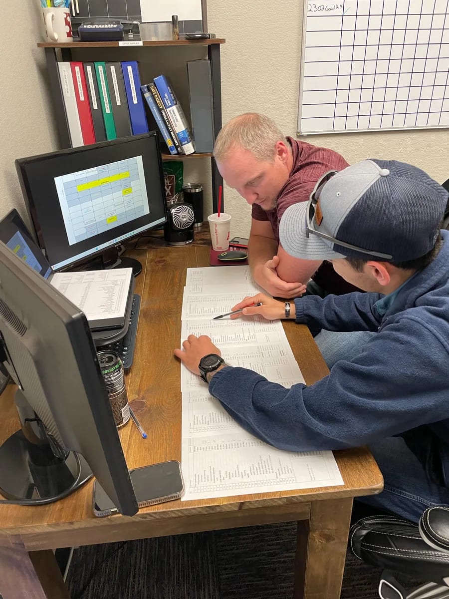 Colleagues reviewing plans together at a desk