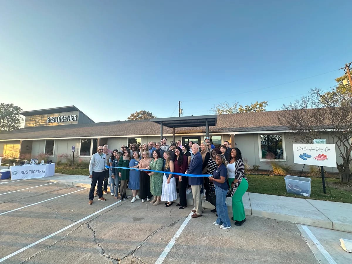A gathering outside BCS Together for a ribbon cutting