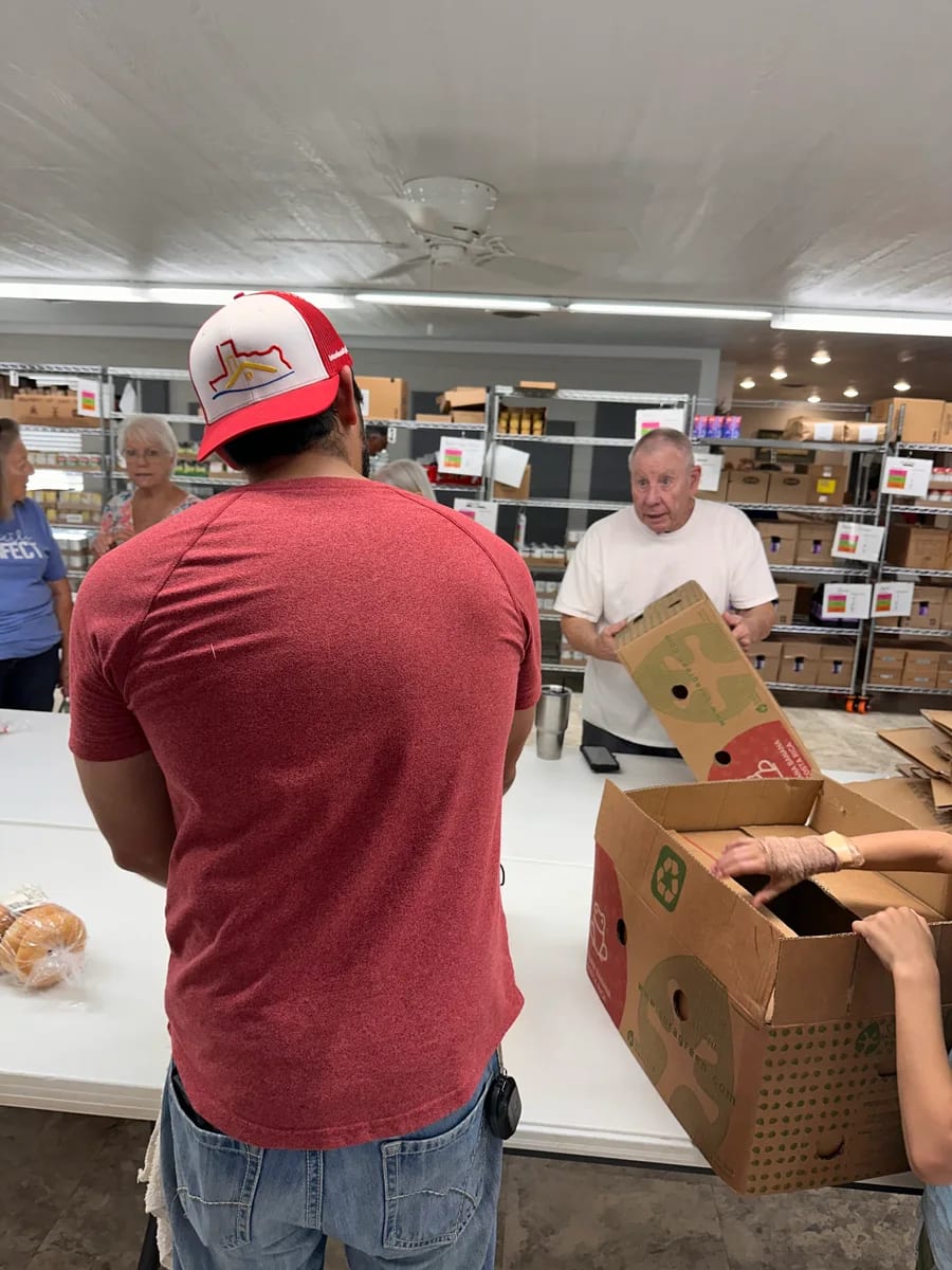 Volunteers helping inside a community pantry